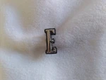 1975 Ford Thunderbird Emblem Letter "e" Front Header Panel. Fixed Price $15.00.